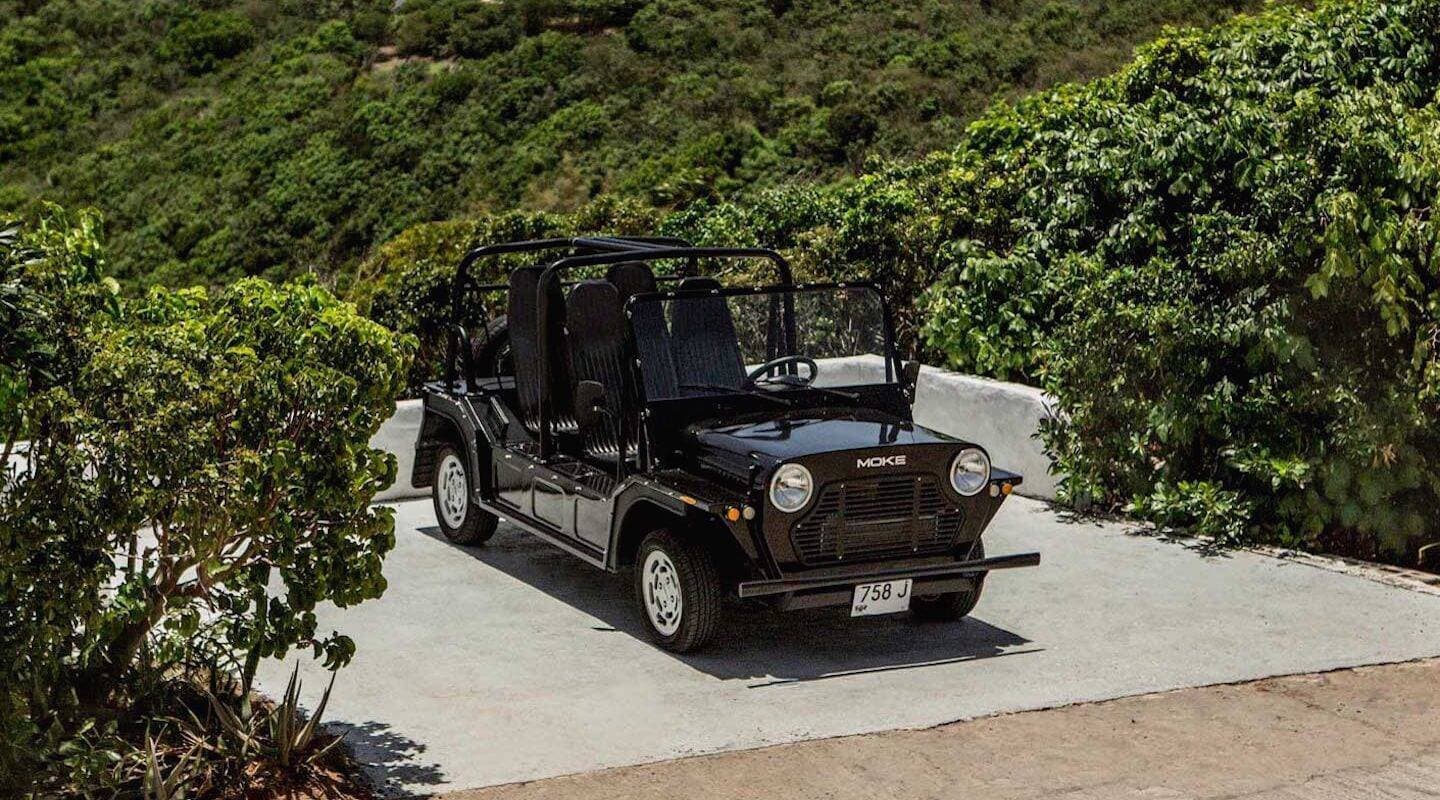 Open-top vehicle on coastal road in St Barth