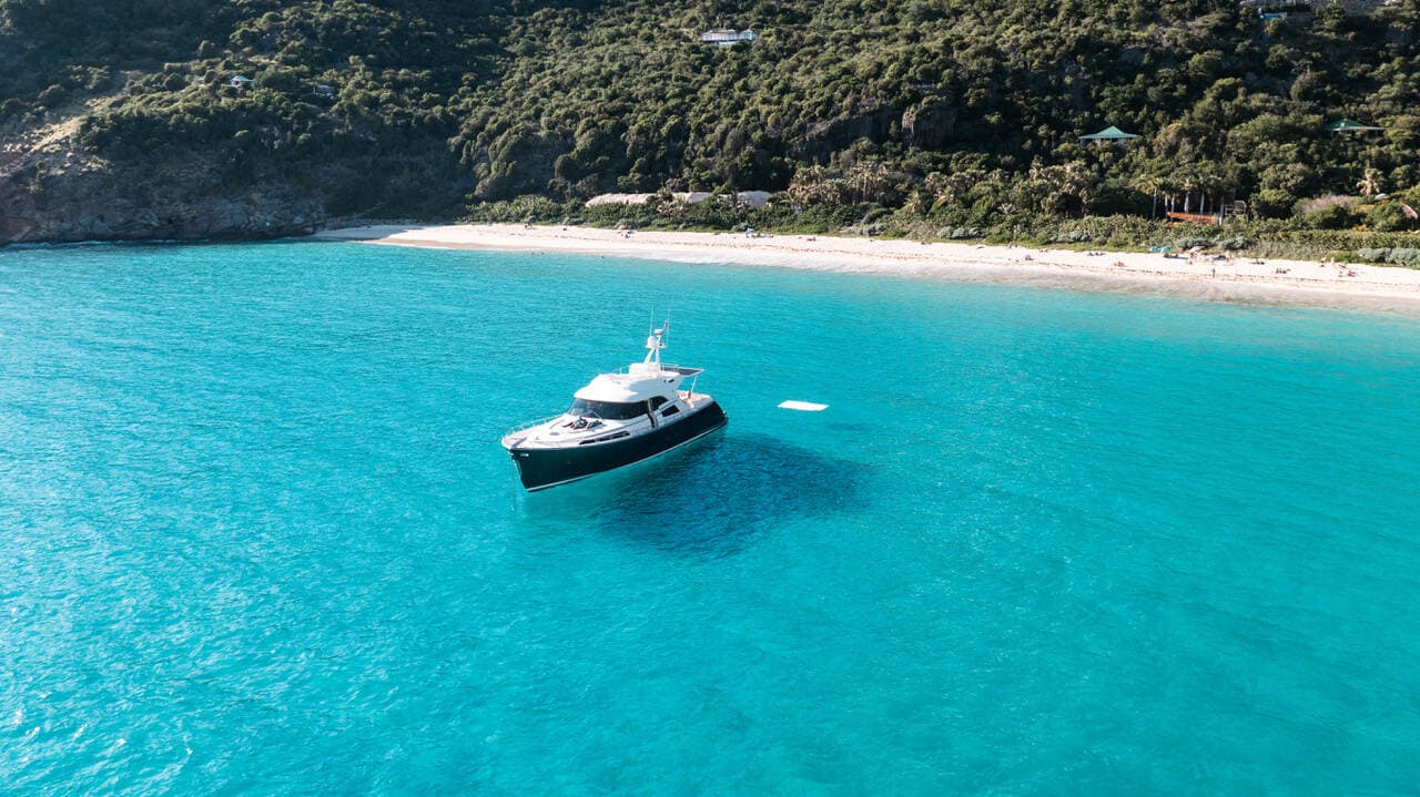 Speedboat crossing turquoise water